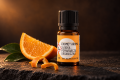 Organiczny olejek eteryczny Słodka Pomarańcza Ekome® w ciemnej aranżacji premium